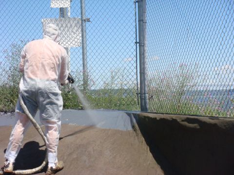 Spray polyurethane foam roof system with protective coating
