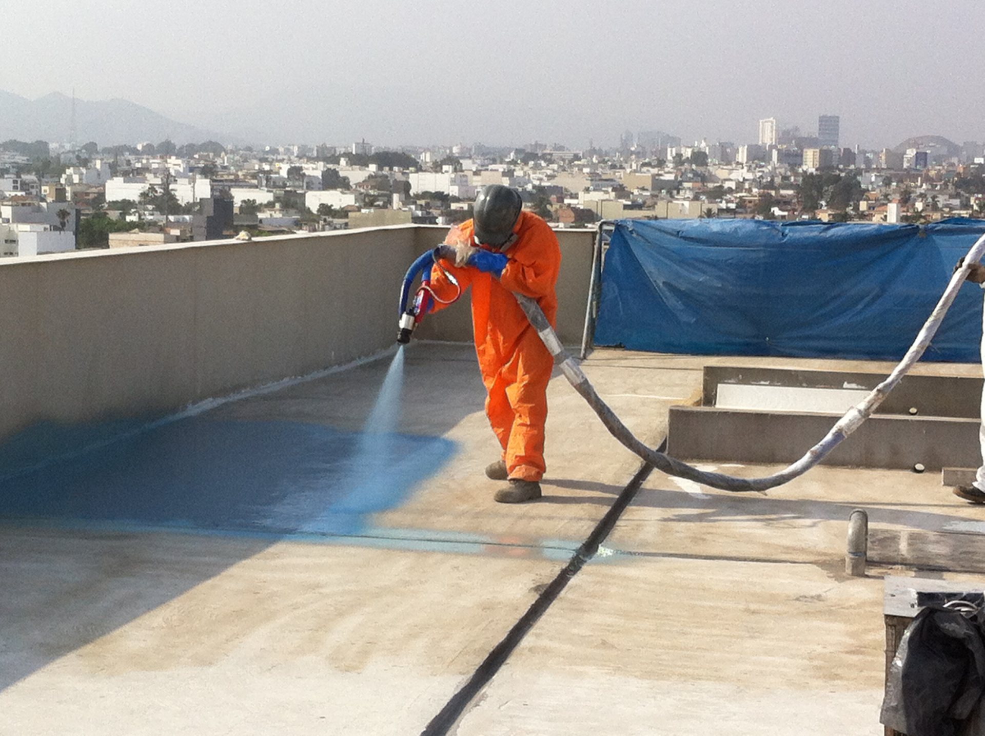 Polyurea roofing membrane spray-applied on a large commercial roof — Oak Ridge contractor project