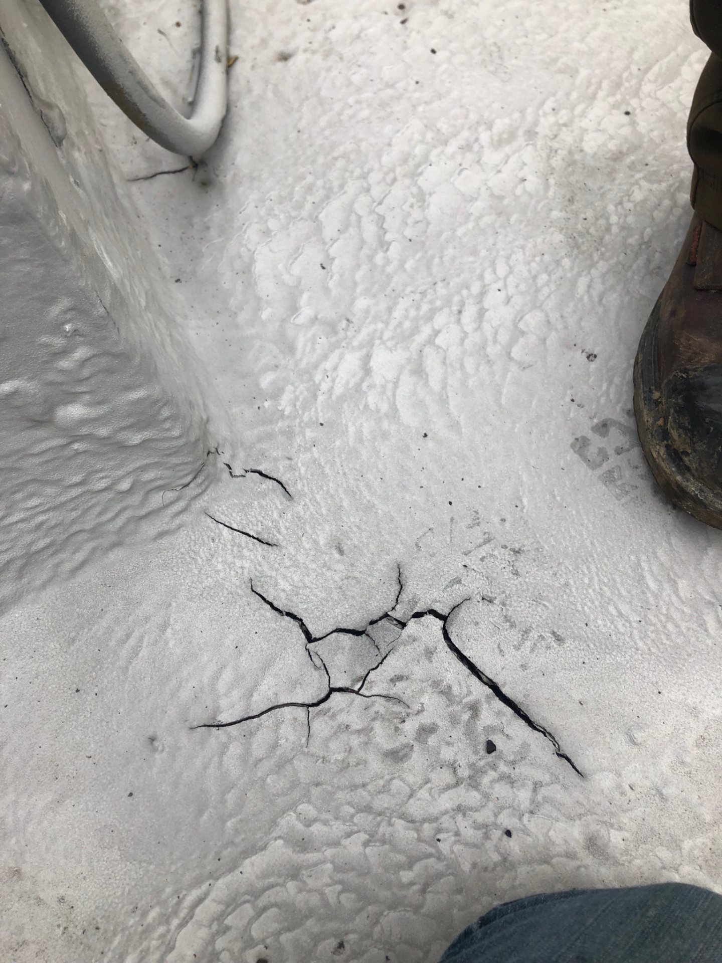 Polyurea coating applied over asphalt surface — seamless protective coating