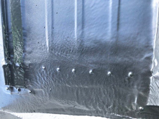 OR-80SLM seamless polyurea membrane detail — no seams, no fasteners at parapet flashing