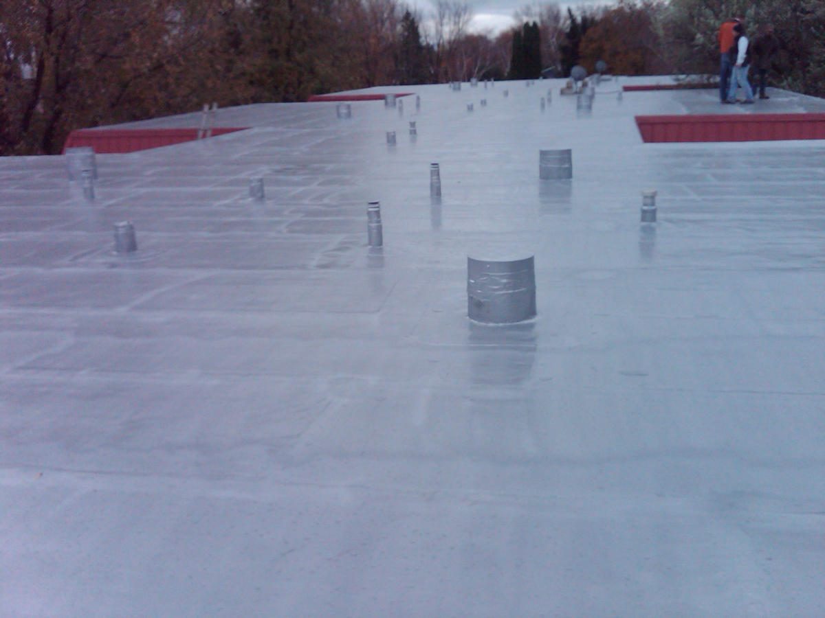OR-80SLM roof coating completed project — white reflective membrane on industrial rooftop
