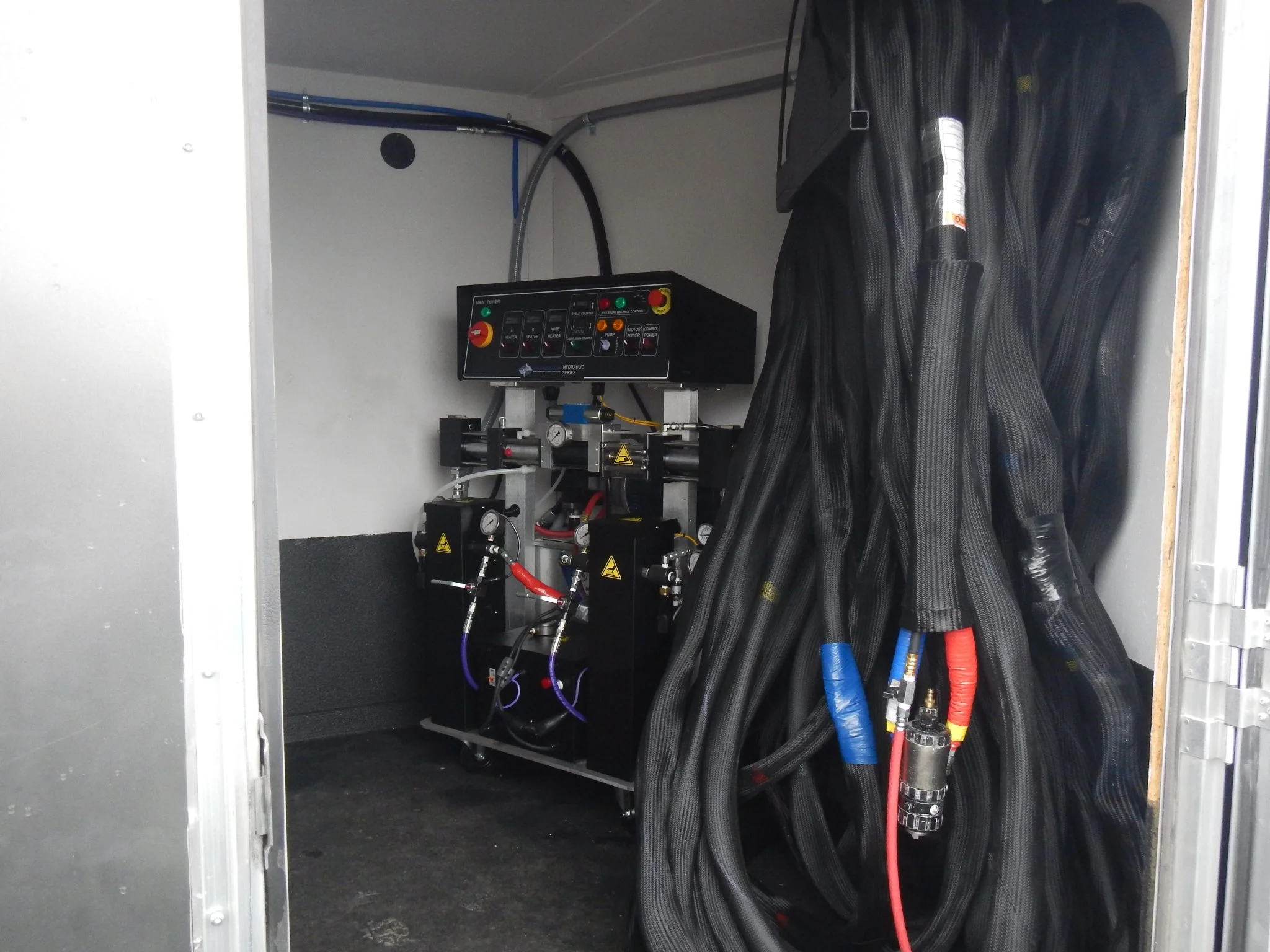 PMC proportioner system for spray foam and polyurea applications