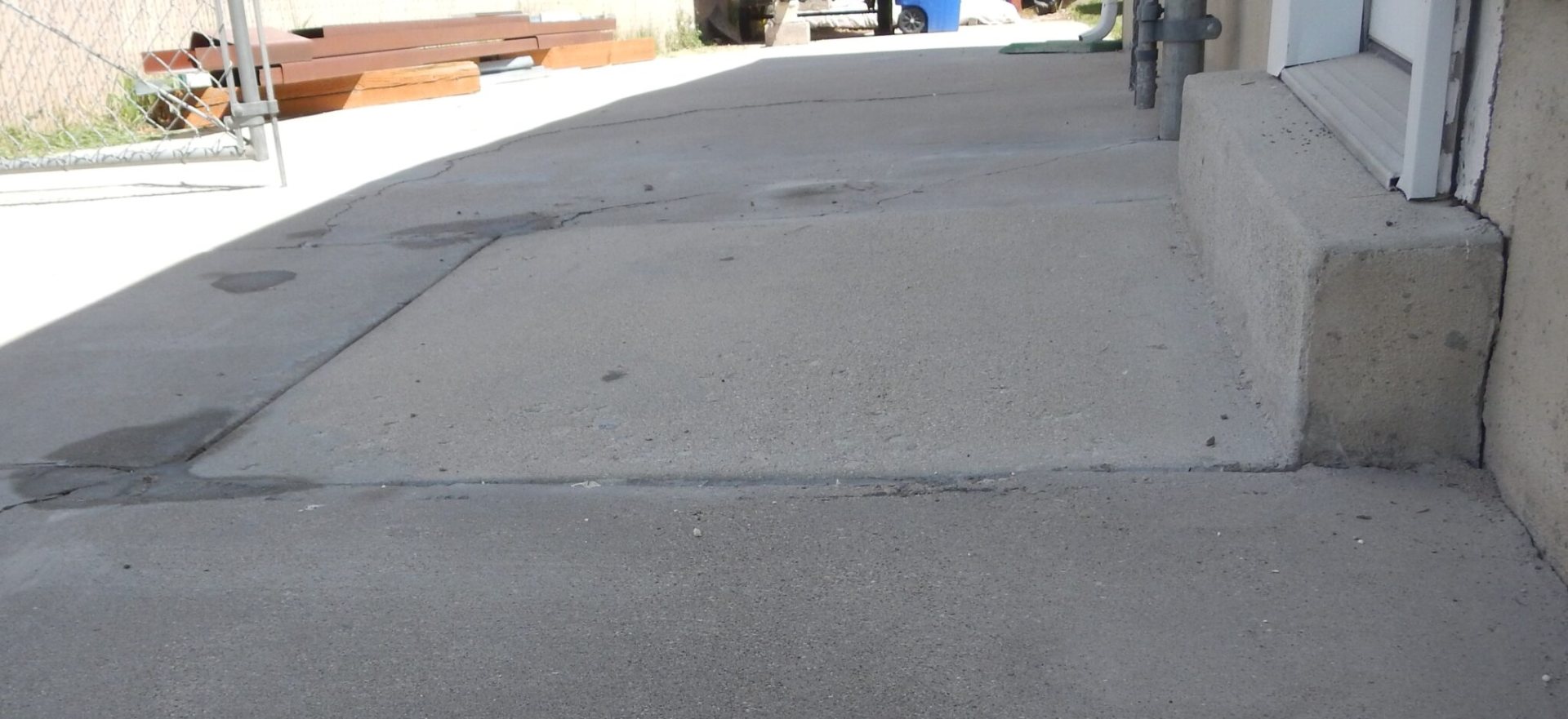 Polyurethane foam injection for concrete slab lifting in progress