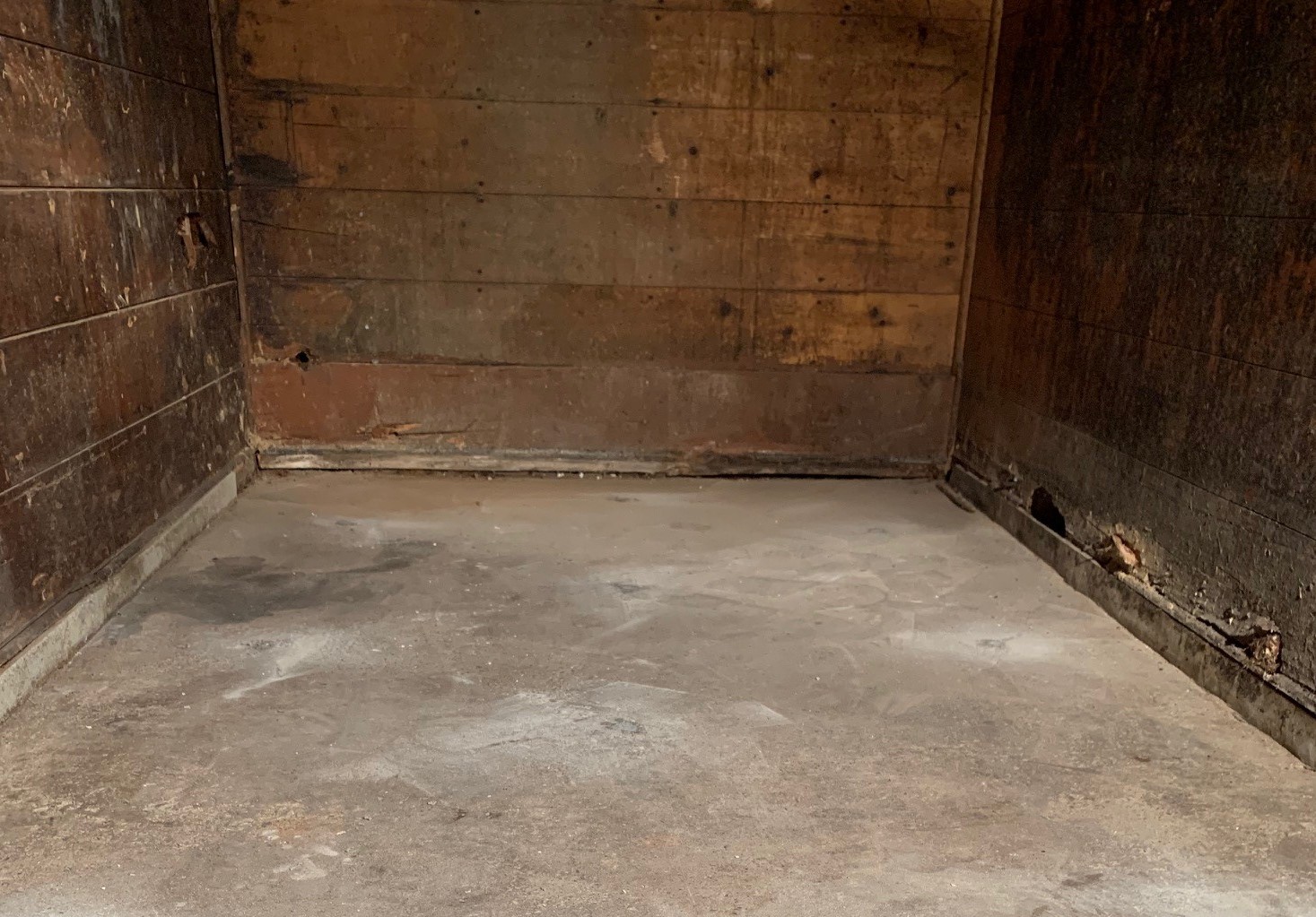 Professional concrete lifting crew using polyurethane foam injection equipment on large slab