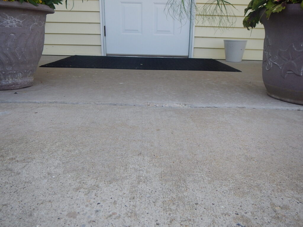 Concrete slab lifted and leveled with polyurethane foam injection