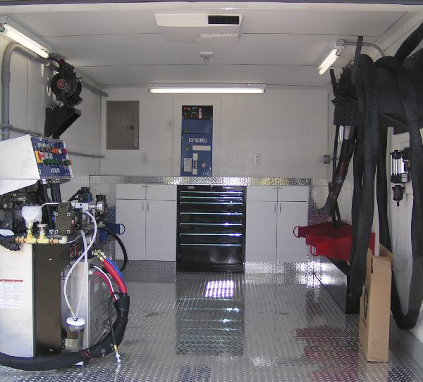 Custom spray rig trailer equipped with PMC proportioner machine, built by Oak Ridge