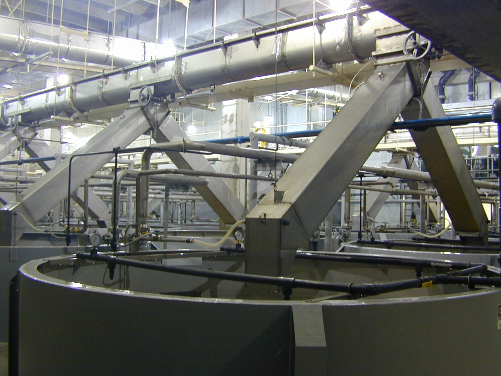 Polyurea-lined clarifier tanks inside a wastewater treatment plant