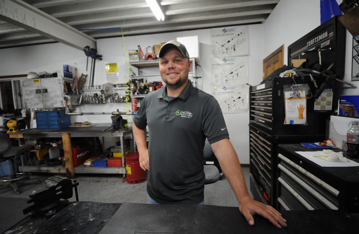 a man standing in a workshop