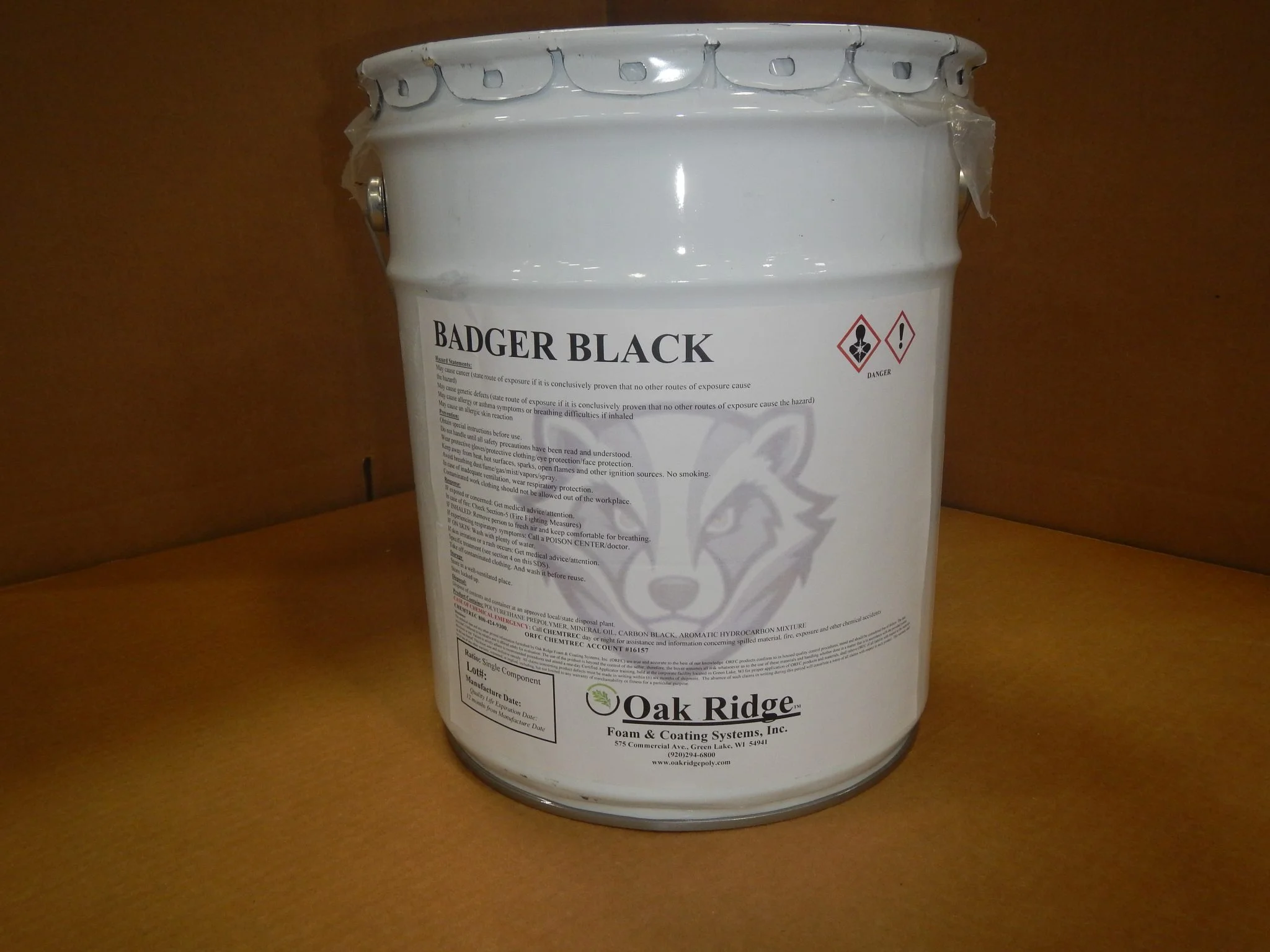 a white bucket with a label on it