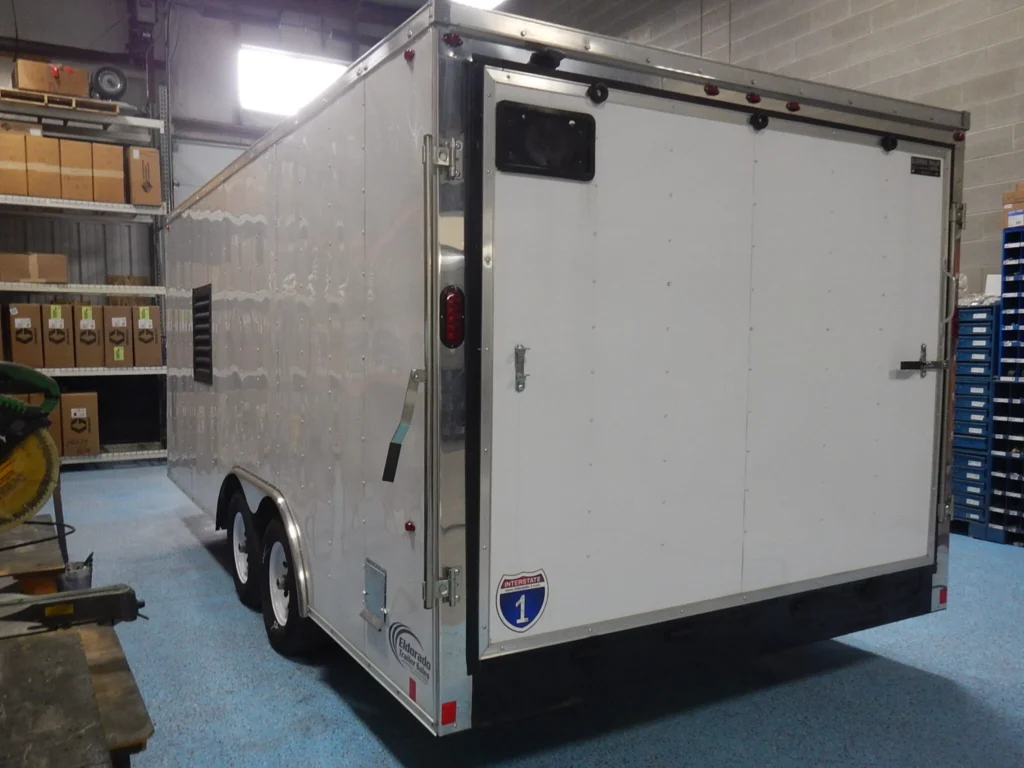 a white trailer in a warehouse