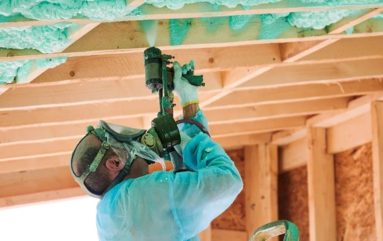a man painting a ceiling