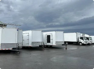 a group of trailers parked in a parking lot