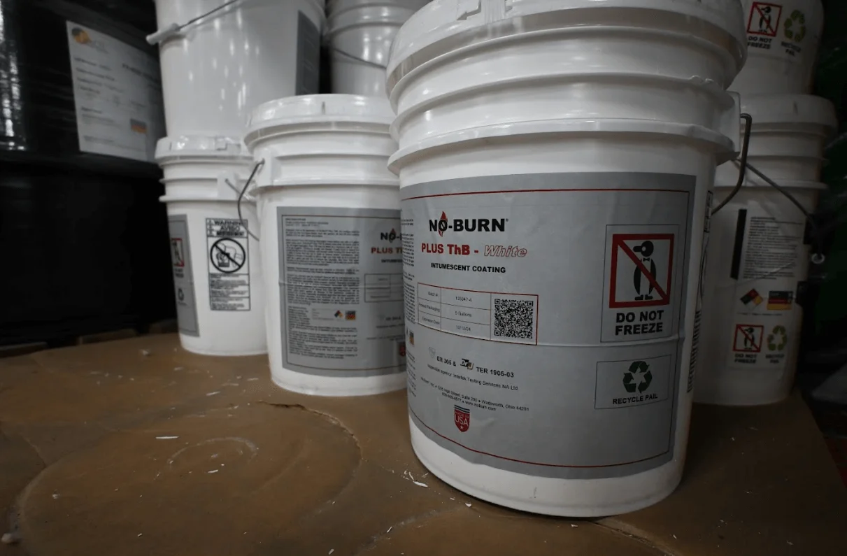 white buckets with labels on them