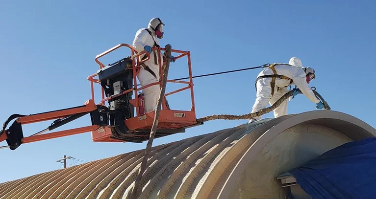 a man in a white suit on a lift