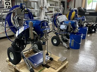 a group of blue machines on a pallet
