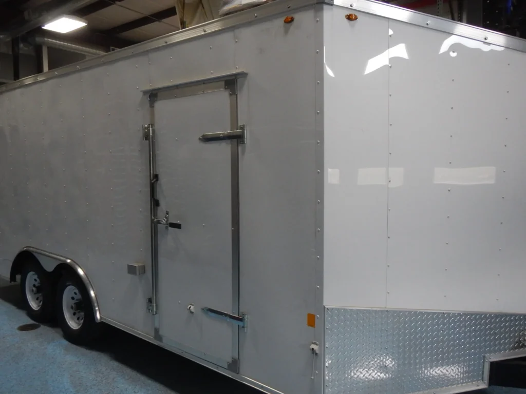 a white trailer with a door