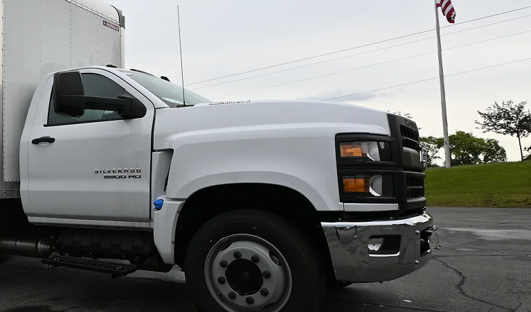 a white truck with a trailer